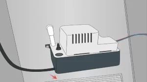 HVAC condensate pump installed beside air handler unit