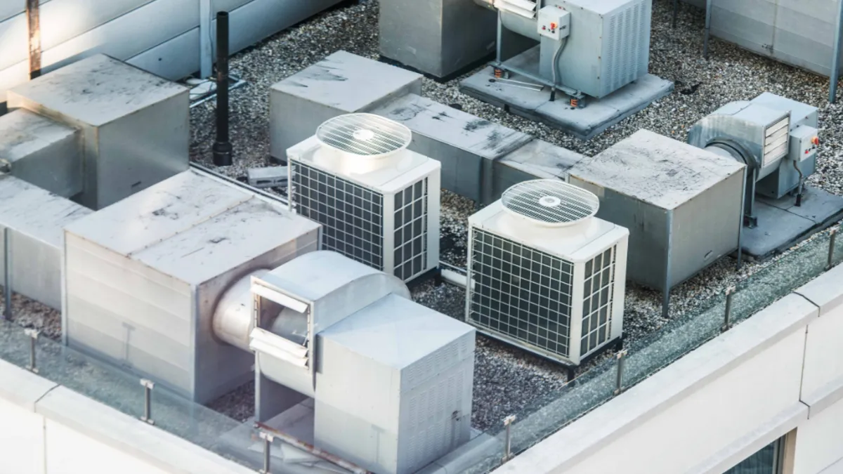 metal HVAC roof cap installed on commercial building roof